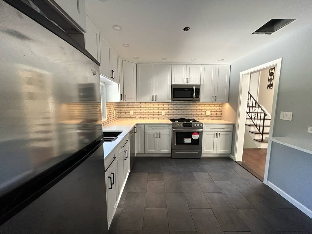 picture of a remodeled luxury kitchen and floor with granite countertops