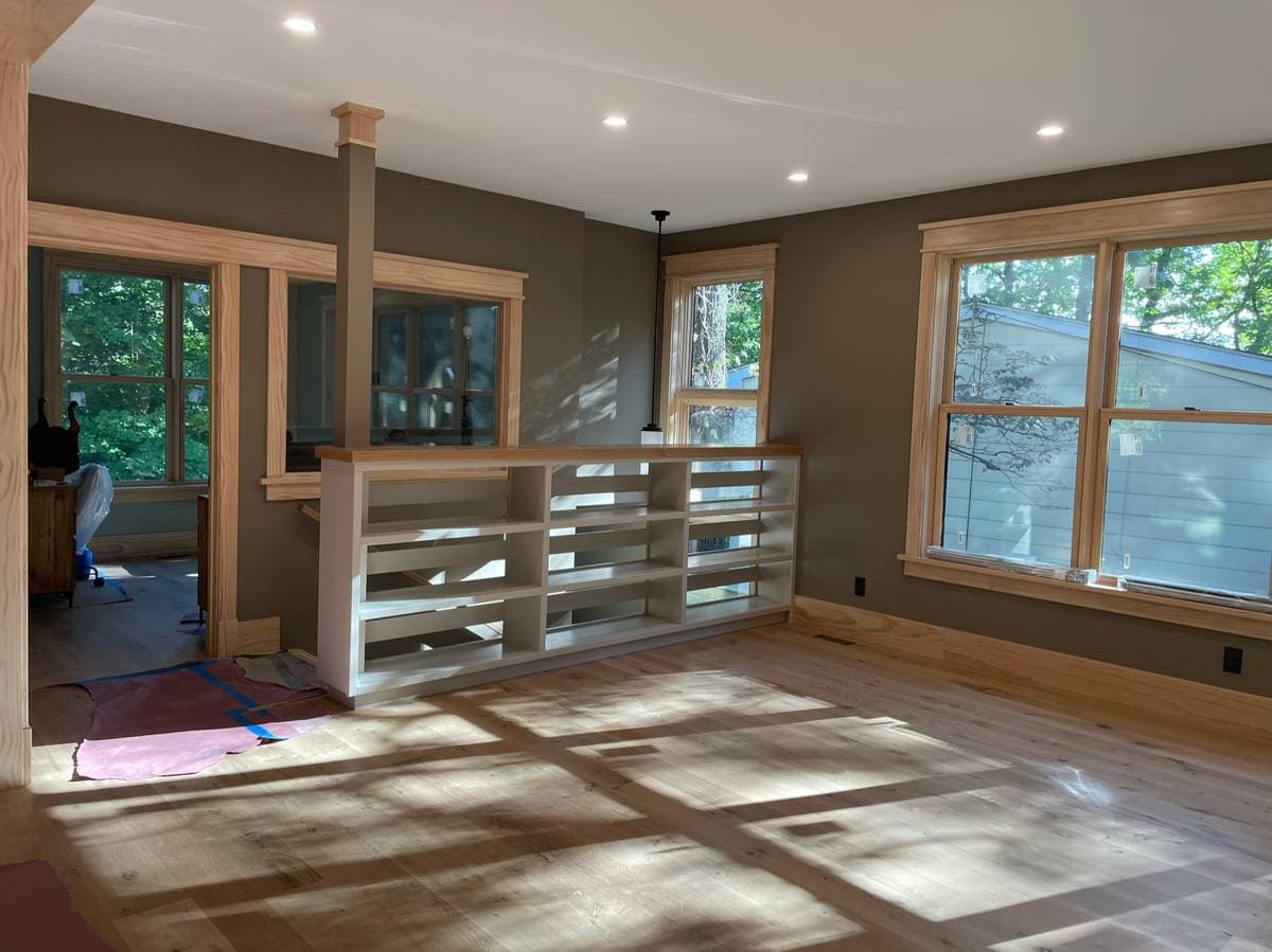 Picture of a living room being remodeled by a handyman 